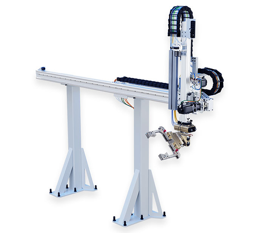 Gantry robots for material handling between machine tools